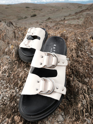 Beige leather sandals with double buckles