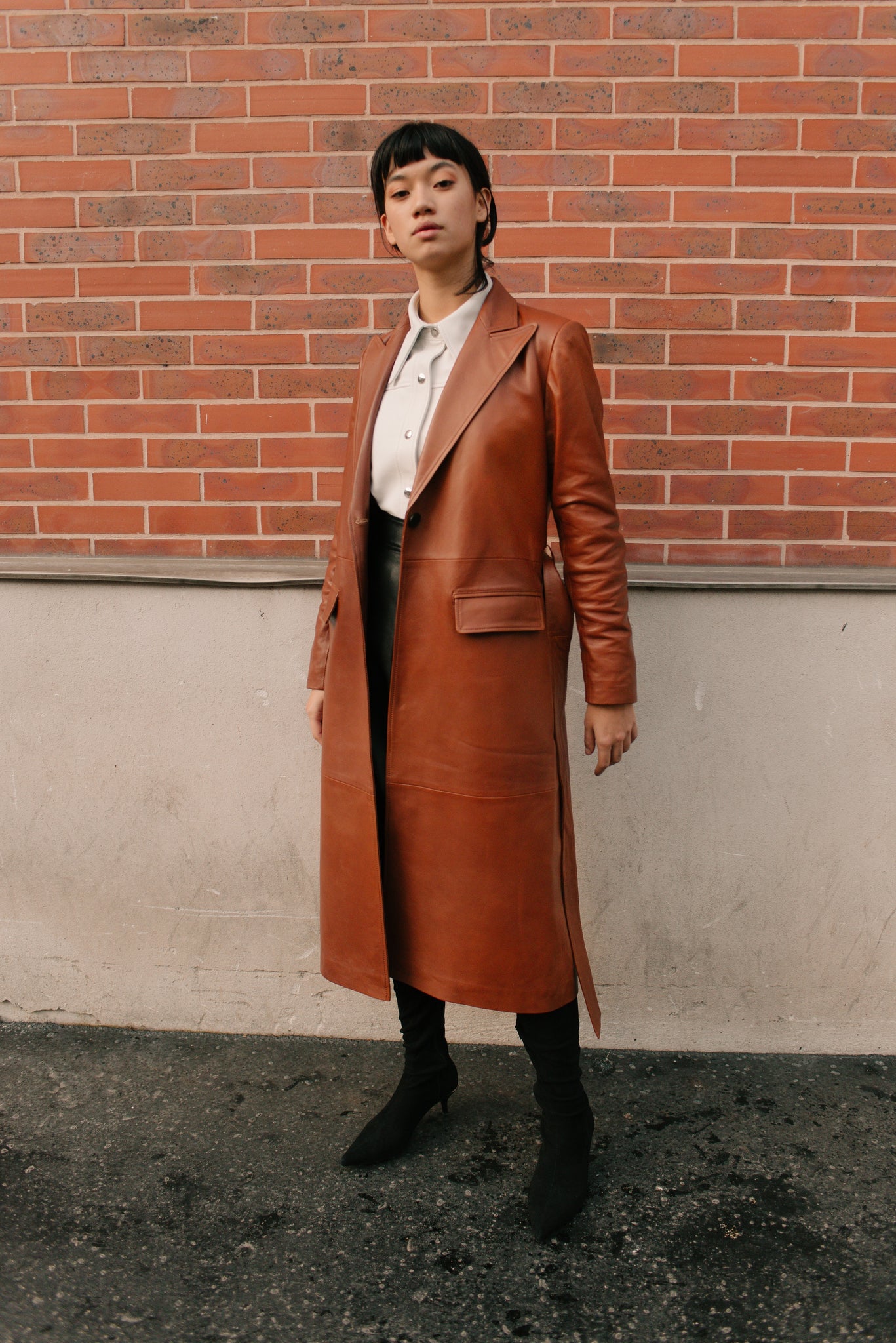 Le long trench en cuir